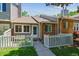 Charming townhome with a fenced front yard, patio and well-maintained lawn at 703 S Depew St, Lakewood, CO 80226