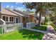 Charming townhome with a fenced front yard, patio and well-maintained lawn at 703 S Depew St, Lakewood, CO 80226