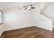 A spacious living room area with hardwood flooring and fan at 703 S Depew St, Lakewood, CO 80226