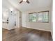 Bright and spacious living room featuring hardwood floors and large windows at 703 S Depew St, Lakewood, CO 80226