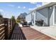 Beautiful back deck with dark wood and outdoor seating creates a relaxing entertainment area at 6777 Mariposa St, Denver, CO 80221