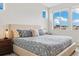 Comfortable bedroom featuring a large bed and abundant natural light from multiple windows at 6777 Mariposa St, Denver, CO 80221