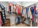 Well-organized walk-in closet with ample hanging space and shelving for clothes and accessories at 6777 Mariposa St, Denver, CO 80221