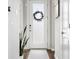 Bright entryway with a frosted glass door, modern accents, and minimalist decor at 6777 Mariposa St, Denver, CO 80221