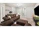 Spacious basement living room with cozy seating and exercise equipment at 6777 Mariposa St, Denver, CO 80221
