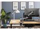 Close-up of a modern desk with a monitor, lamp, and stylish decor in a contemporary office at 6777 Mariposa St, Denver, CO 80221