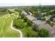 Aerial shot of a home near a golf course, showcasing its proximity to recreational amenities and natural beauty at 1001 Deer Clover Way, Castle Pines, CO 80108