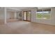 Spacious finished basement with carpeting, large windows, and a walk-out door at 1001 Deer Clover Way, Castle Pines, CO 80108