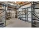 Unfinished basement with metal shelving offering ample storage space at 1001 Deer Clover Way, Castle Pines, CO 80108
