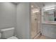 Modern bathroom with a glass-enclosed shower and neutral-toned vanity at 1001 Deer Clover Way, Castle Pines, CO 80108