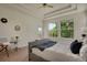 Bright bedroom with a modern design and large windows overlooking the outdoor deck at 1001 Deer Clover Way, Castle Pines, CO 80108