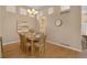 Dining room features hardwood floors, and an abundance of natural light at 1001 Deer Clover Way, Castle Pines, CO 80108