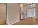 Inviting foyer with neutral-toned walls, hardwood floors, and stylish decor at 1001 Deer Clover Way, Castle Pines, CO 80108