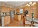 Kitchen featuring wood cabinetry, stainless steel appliances, and granite countertops at 1001 Deer Clover Way, Castle Pines, CO 80108
