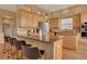 Kitchen island featuring granite counters, wooden cabinets, and stainless steel appliances at 1001 Deer Clover Way, Castle Pines, CO 80108