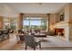 Inviting living room with large windows, comfortable seating, and a cozy atmosphere at 1001 Deer Clover Way, Castle Pines, CO 80108