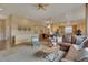 Spacious living room with an open floor plan and connection to the dining and kitchen areas at 1001 Deer Clover Way, Castle Pines, CO 80108