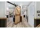 Finished basement with decorative sliding barn door to bonus room at 9821 Bucknell Ct, Highlands Ranch, CO 80129