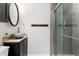 Stylish bathroom with a glass vessel sink and a modern shower at 9821 Bucknell Ct, Highlands Ranch, CO 80129