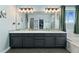 Beautiful bathroom with double sink vanity, quartz countertops, and updated fixtures at 9821 Bucknell Ct, Highlands Ranch, CO 80129
