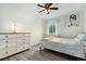 Cozy bedroom with ceiling fan, natural light, and ample closet space at 9821 Bucknell Ct, Highlands Ranch, CO 80129