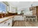 Updated kitchen with stainless steel appliances and breakfast bar at 9821 Bucknell Ct, Highlands Ranch, CO 80129