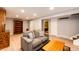 Basement Gathering room offers recessed lighting, neutral paint, and a comfortable sitting area at 1140 S Dover St, Lakewood, CO 80232