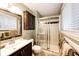Clean bathroom with a shower, vanity, and neutral-toned decor at 1140 S Dover St, Lakewood, CO 80232