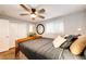Bright bedroom with a ceiling fan, and a large window for natural light at 1140 S Dover St, Lakewood, CO 80232
