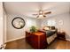 Comfortable bedroom with a ceiling fan, dresser, and ample natural light at 1140 S Dover St, Lakewood, CO 80232
