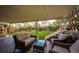 Inviting covered patio with comfortable seating, perfect for relaxing and enjoying the outdoor space at 1140 S Dover St, Lakewood, CO 80232