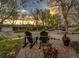 View from patio of a peaceful, tree-lined street at sunset at 1140 S Dover St, Lakewood, CO 80232