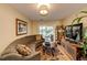 Cozy living room area with access to backyard patio through sliding glass doors at 1140 S Dover St, Lakewood, CO 80232