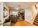 Cozy living room featuring a walk-out to the patio and a staircase to the upper level at 1140 S Dover St, Lakewood, CO 80232