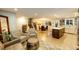 Open-concept living space features a modern kitchen, dining area, and comfortable seating at 1140 S Dover St, Lakewood, CO 80232
