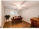 Home office with sleek wood floors, lots of natural light, and a ceiling fan at 1140 S Dover St, Lakewood, CO 80232