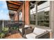 Outdoor balcony with lounge seating, brick exterior and views of the neighboring building at 2960 Inca St # 317, Denver, CO 80202