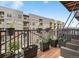 Outdoor balcony with planters, modern railing and views of the neighborhood at 2960 Inca St # 317, Denver, CO 80202