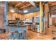 Kitchen boasts exposed brick walls, modern island, and stainless steel appliances at 2960 Inca St # 317, Denver, CO 80202