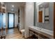 Hall bathroom with vessel sink, wood-look floors, and contemporary finishes at 5140 S Kearney Ct, Greenwood Village, CO 80111