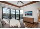 Bedroom features a wall of windows with access to a balcony, wooden dresser and ceiling trim at 5140 S Kearney Ct, Greenwood Village, CO 80111