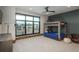 Bright bedroom with a bunk bed, large windows, and a ceiling fan at 5140 S Kearney Ct, Greenwood Village, CO 80111