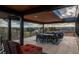 Open air deck with a large table set, chairs, and beautiful mountain views at 5140 S Kearney Ct, Greenwood Village, CO 80111