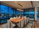 Elegant dining room showcases a large wood table and floor-to-ceiling windows with scenic views at 5140 S Kearney Ct, Greenwood Village, CO 80111