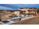 Expansive modern home with outdoor kitchen, pool and dining areas that offers a luxurious outdoor entertaining at 5140 S Kearney Ct, Greenwood Village, CO 80111