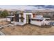 Aerial view of a modern luxury home with clean lines and a well-manicured front lawn at 5140 S Kearney Ct, Greenwood Village, CO 80111