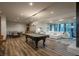 Spacious game room with a pool table, lounge, and dining area at 5140 S Kearney Ct, Greenwood Village, CO 80111