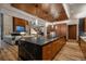 Open concept kitchen with a central island, view of the living room, and high end appliances at 5140 S Kearney Ct, Greenwood Village, CO 80111