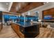 Gourmet kitchen featuring a large island, breakfast bar, and an open concept design at 5140 S Kearney Ct, Greenwood Village, CO 80111