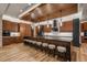 Contemporary kitchen with a dark island, wood cabinets, and sleek appliances at 5140 S Kearney Ct, Greenwood Village, CO 80111